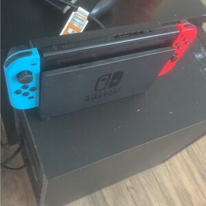 Nintendo Switch Console with Neon Blue and Red Joy-Con